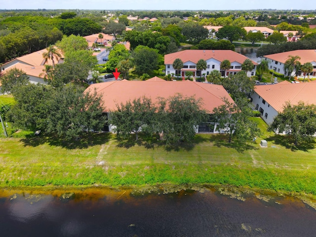 drone / aerial view with a residential view and a water view