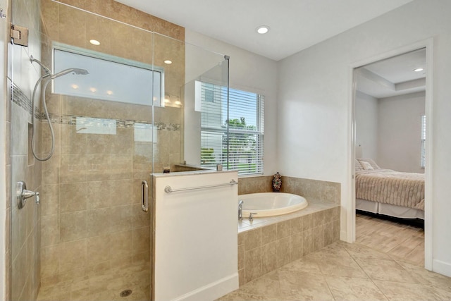 ensuite bathroom with a stall shower, ensuite bathroom, a garden tub, tile patterned flooring, and recessed lighting