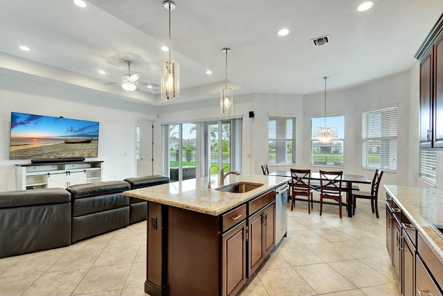 kitchen with stainless steel dishwasher, light tile patterned flooring, a sink, and visible vents