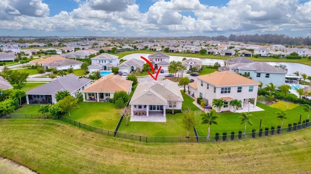 birds eye view of property with a residential view