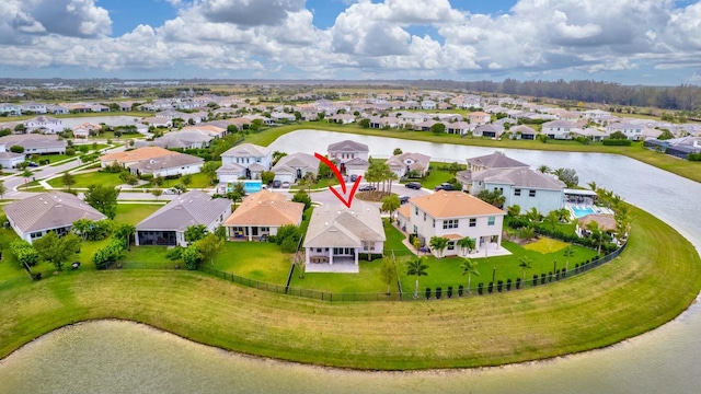 aerial view with a residential view and a water view