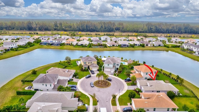 aerial view with a water view and a residential view