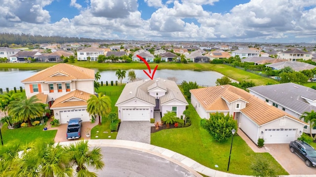 aerial view featuring a residential view and a water view