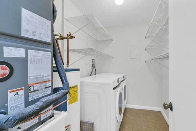6620 Boca De Mar Dr Unit 105, Boca Raton, FL 33433 - clothes washing area featuring laundry area, a textured ceiling, washing machine and clothes dryer, water heater, and tile patterned floors