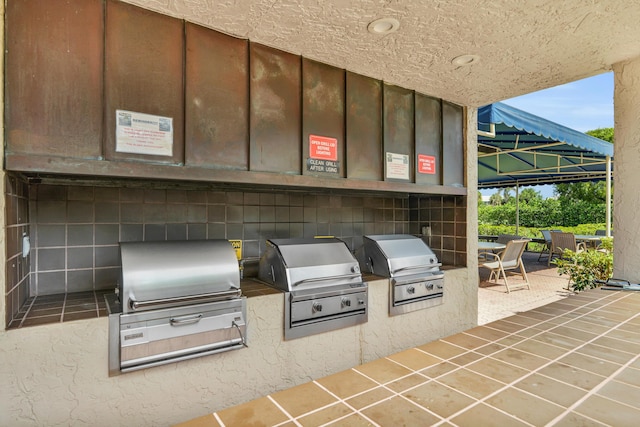 6620 Boca De Mar Dr Unit 105, Boca Raton, FL 33433 - view of patio featuring exterior kitchen and grilling area