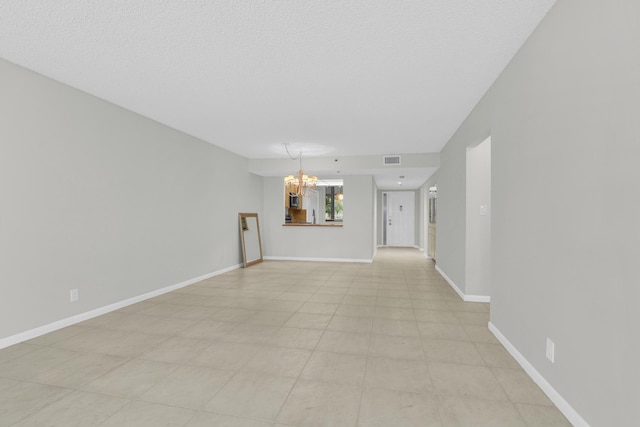 6620 Boca De Mar Dr Unit 105, Boca Raton, FL 33433 - empty room with baseboards, a notable chandelier, and visible vents