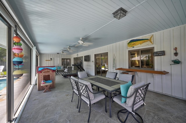 exterior space with a wealth of natural light and ceiling fan