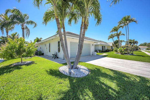 view of property exterior with a lawn, concrete driveway, and an attached garage