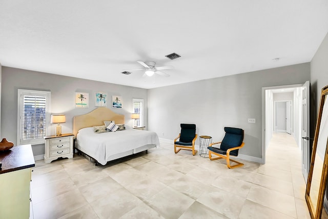 bedroom with visible vents, baseboards, and a ceiling fan