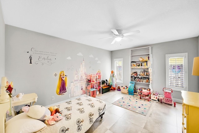 bedroom featuring a ceiling fan and tile patterned flooring