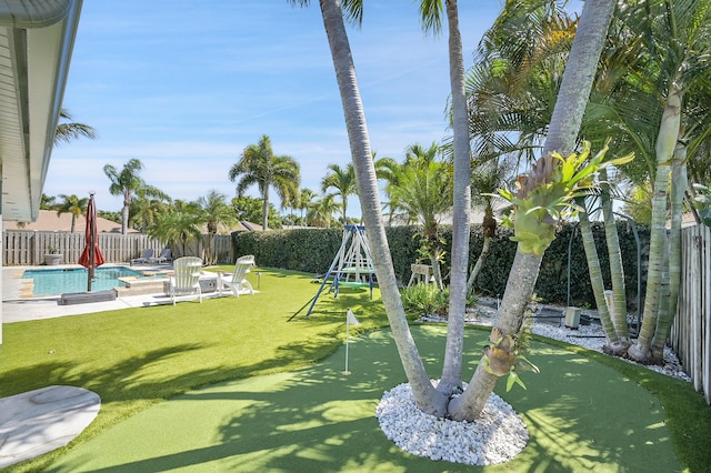 view of yard with a fenced in pool, a patio, and a fenced backyard