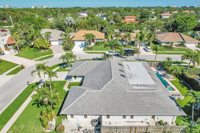 birds eye view of property with a residential view