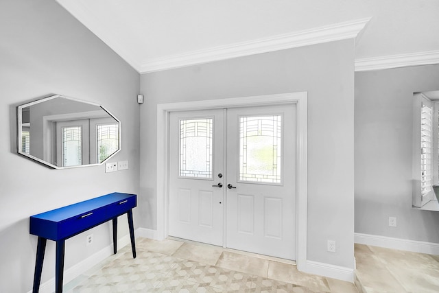 foyer entrance with baseboards and ornamental molding