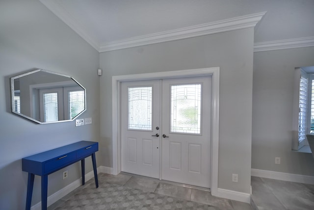 foyer entrance featuring french doors, baseboards, and ornamental molding