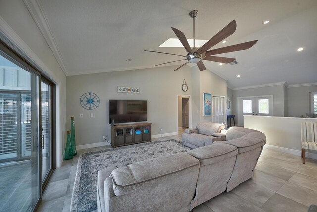 living area featuring a ceiling fan, baseboards, recessed lighting, ornamental molding, and vaulted ceiling