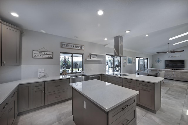 kitchen with island range hood, a peninsula, gray cabinets, and black electric cooktop