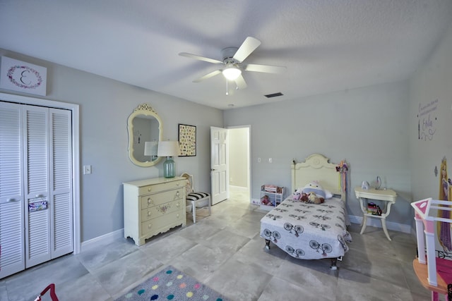 bedroom featuring a closet, baseboards, and ceiling fan