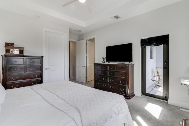 carpeted bedroom with access to exterior, visible vents, and baseboards