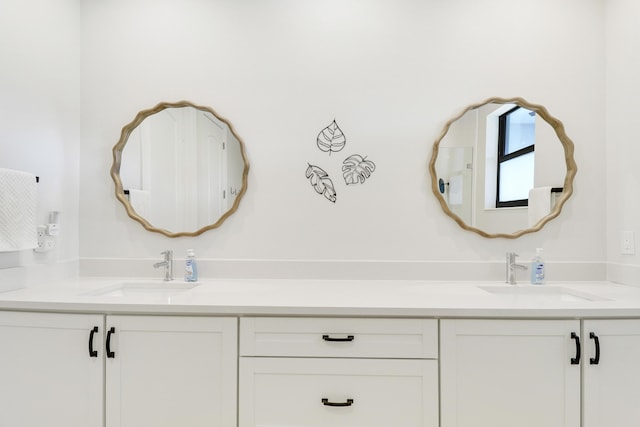 full bath featuring double vanity and a sink