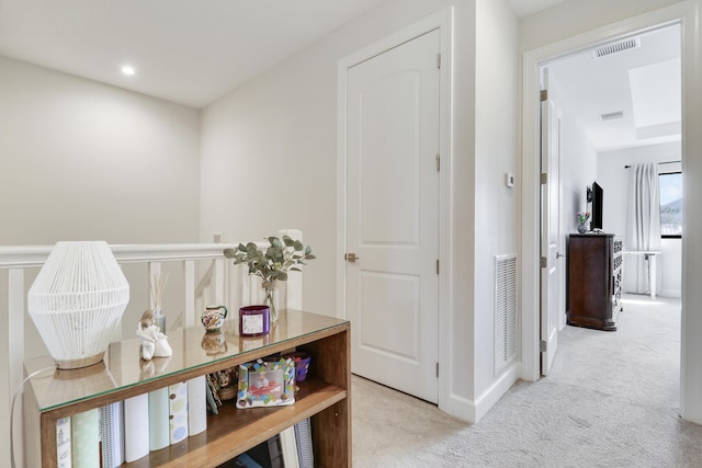 hallway with carpet, visible vents, and recessed lighting