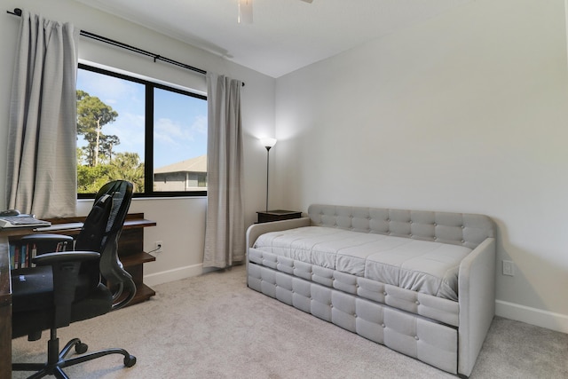 bedroom with carpet flooring and baseboards