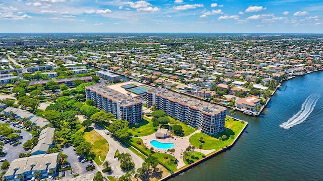 birds eye view of property featuring a view of city and a water view