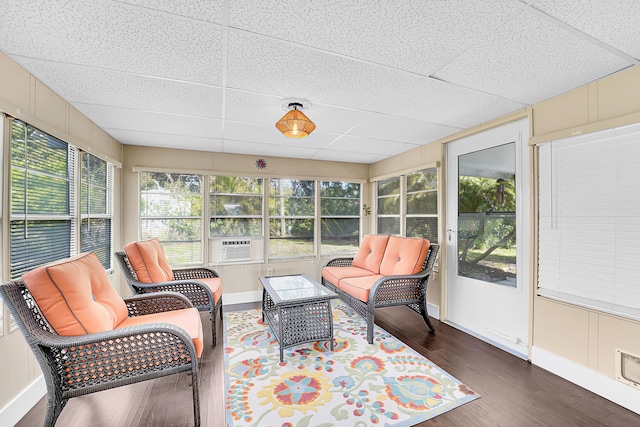 sunroom / solarium featuring a paneled ceiling