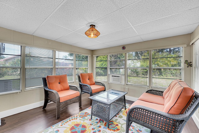 sunroom with a drop ceiling and cooling unit