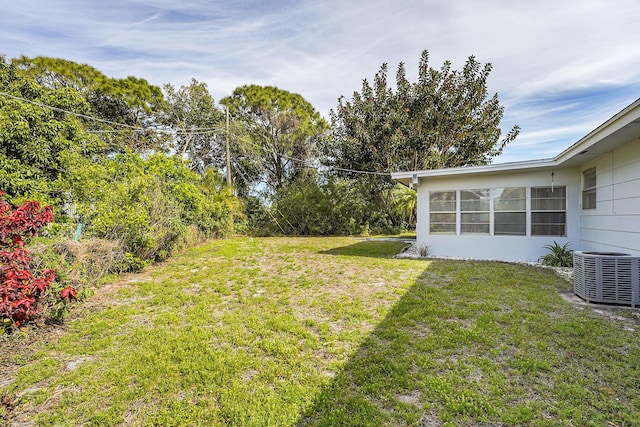 view of yard featuring central AC