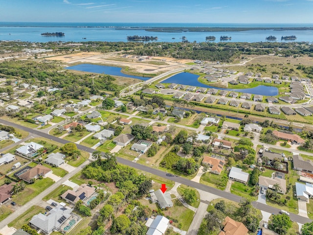 bird's eye view with a residential view and a water view