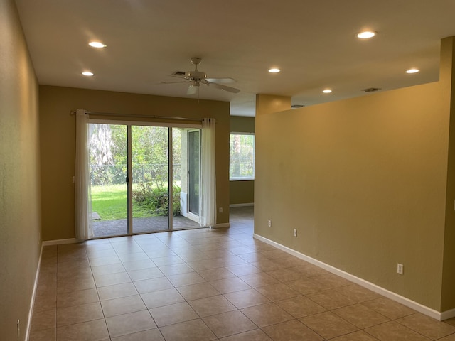 empty room with recessed lighting, ceiling fan, baseboards, and light tile patterned floors