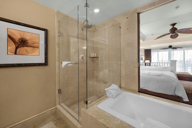 ensuite bathroom with ensuite bathroom, recessed lighting, baseboards, a bath, and a stall shower