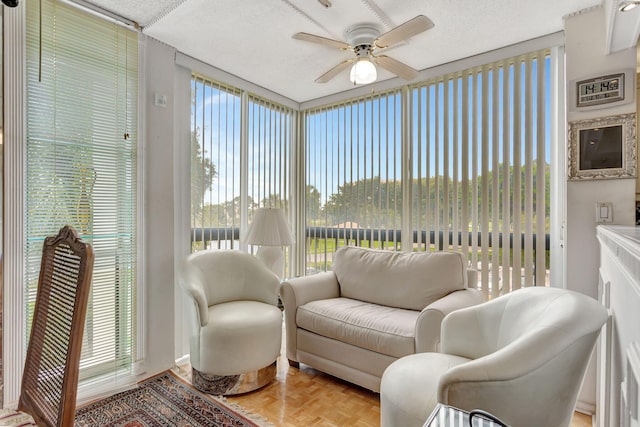 sunroom with a ceiling fan