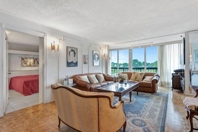 living area featuring a textured ceiling