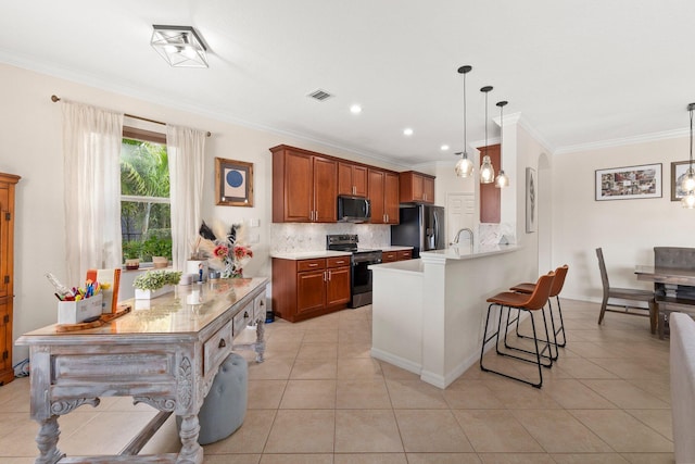 kitchen featuring light tile patterned flooring, a peninsula, visible vents, a kitchen breakfast bar, and appliances with stainless steel finishes