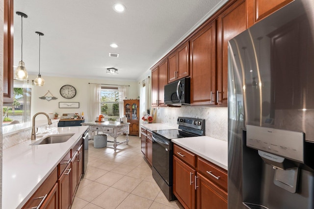 kitchen featuring light tile patterned floors, a sink, light countertops, black appliances, and backsplash