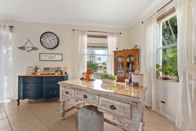 office area featuring crown molding, light tile patterned floors, baseboards, and a healthy amount of sunlight