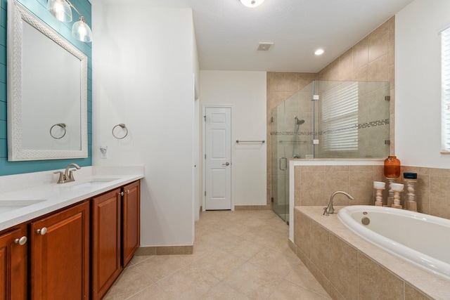 full bath featuring a garden tub, a sink, baseboards, a shower stall, and double vanity