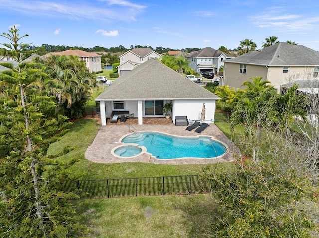 view of swimming pool with a patio area, a fenced backyard, and a lawn