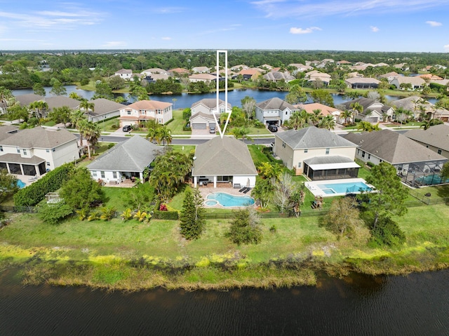 bird's eye view featuring a residential view and a water view