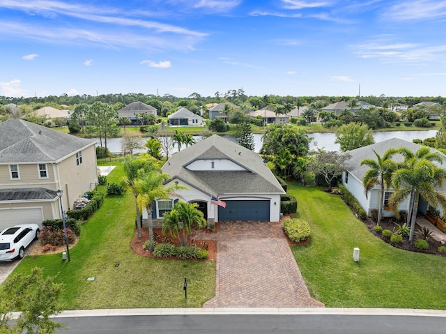 birds eye view of property with a residential view and a water view