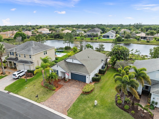 bird's eye view featuring a water view and a residential view