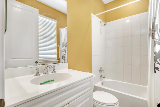 bathroom featuring vanity, toilet, and shower / bathtub combination with curtain