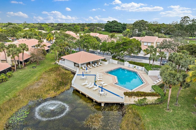 pool featuring fence, a lawn, and a gazebo