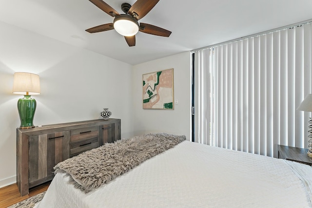 bedroom featuring a ceiling fan and wood finished floors