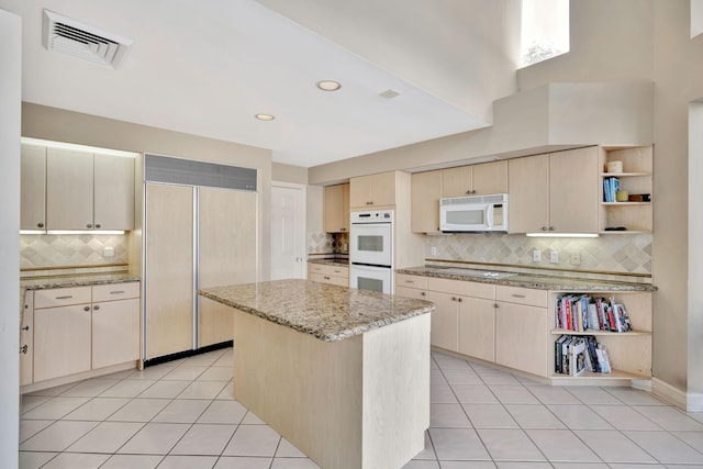 kitchen with white appliances, light tile patterned flooring, visible vents, and open shelves