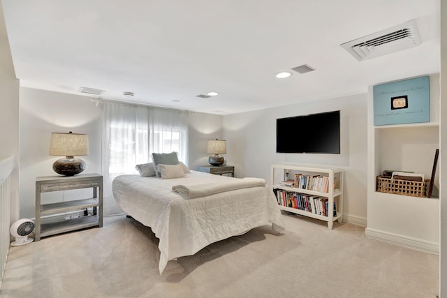 carpeted bedroom with recessed lighting, visible vents, and baseboards