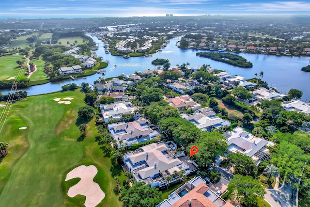 bird's eye view with golf course view, a water view, and a residential view