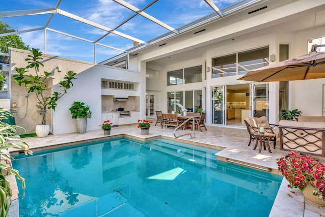 pool with a patio area, area for grilling, glass enclosure, and outdoor dining space