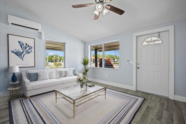 living room with a wall mounted AC, ceiling fan, vaulted ceiling, wood finished floors, and baseboards